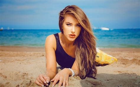 Download Beautiful Woman On Beach Wallpaper