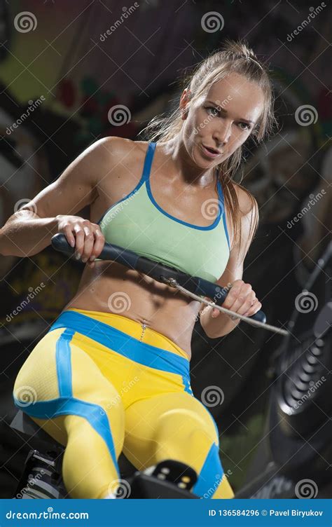 Sporty Blonde Woman Exercising On Rowing Machine Stock Photo Image Of Female Hard 136584296