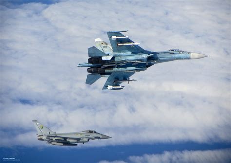 A Raf Typhoon Intercepting A Russian Su Flanker As Part Of Natos