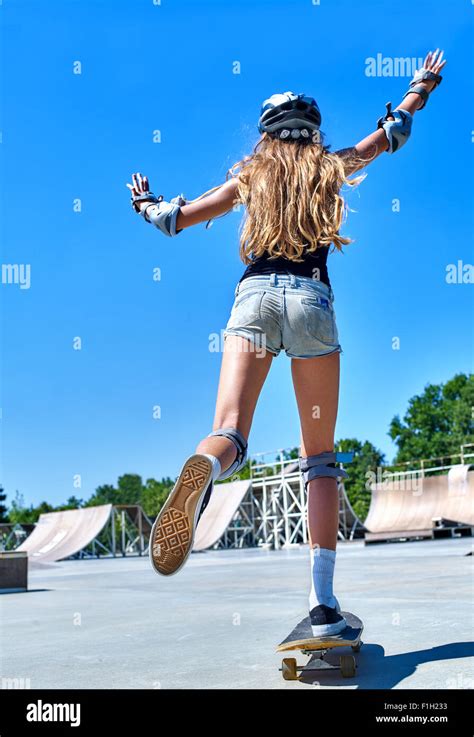 Teen girl rides his skateboard Stock Photo - Alamy