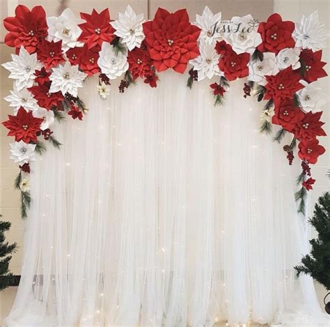 Christmas themed paper flower backdrop with red and white poinsettias ...