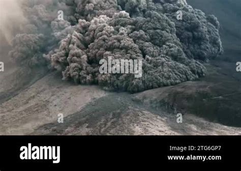 Spectacular volcanic eruption. Huge boulders are thrown from the ash cloud. Mount Danau Toba ...