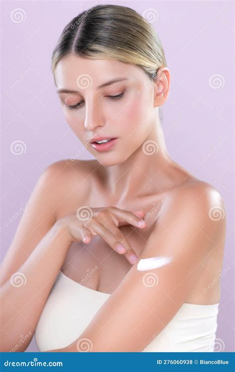 Alluring Beautiful Woman Applying Moisturizer Cream On Her Arm Concept