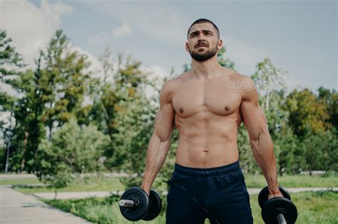 Fitness Athlete Muscular Man Holds Barbells In Hands Has Naked Perfect