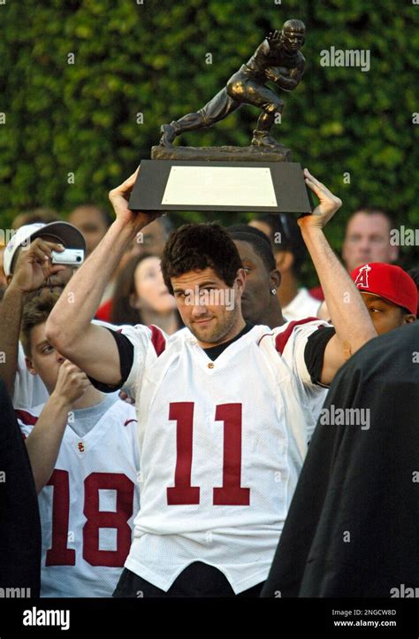 Heisman Trophy Winning Quarterback Matt Leinart Lifts His Trophy Friday