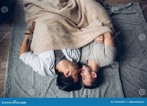 Handsome Sleepy Man With Bristle Kissing Good Night Male Partner Lying