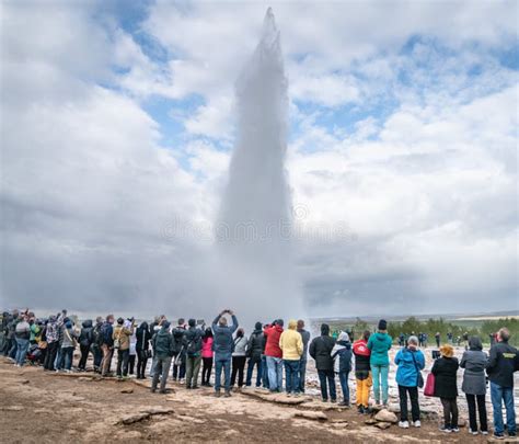 The Strokkur Geyser In Iceland Is Erupting While Tourists Are Watching