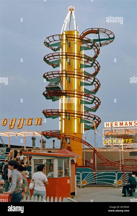 Dusk At The Fairground Rides With The Toboggan Ride Illuminated At