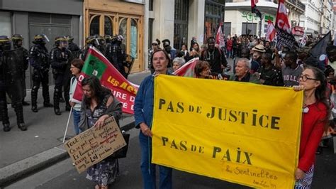 Tensions erupt at Paris protest against cop brutality; police car ...