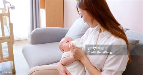 Mother Giving Milk To Baby High Res Stock Photo Getty Images