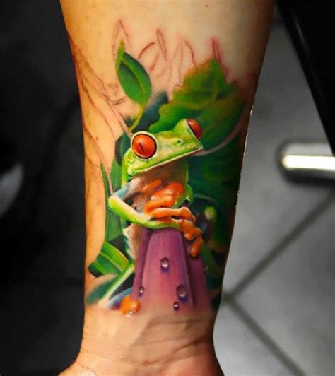 New school tree frog tattoo on forearm represents freedom, luck, change, calm, and it is very ...