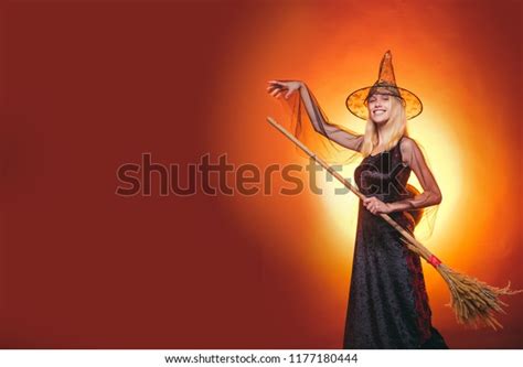 Sexy Blonde Witch Dressed On Halloween Stock Photo