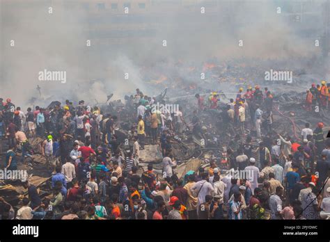 Firefighters Rescue Workers And Local People Work To Extinguish A