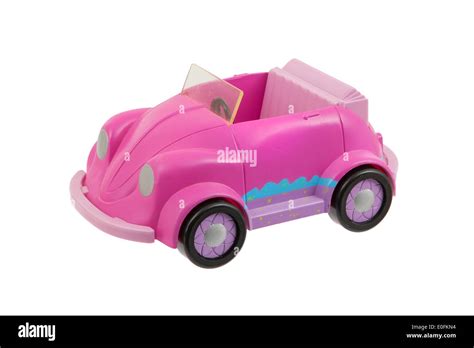 Old pink plastic toy car isolated on white Stock Photo - Alamy