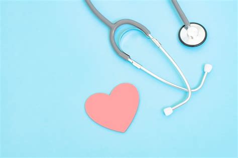 Premium Photo Stethoscope And Red Heart Shape On Blue Background