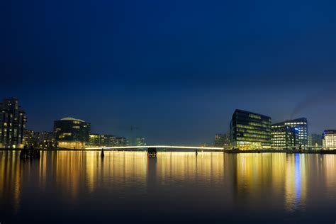 720x1280 Resolution City Buildings And Body Of Water During Night