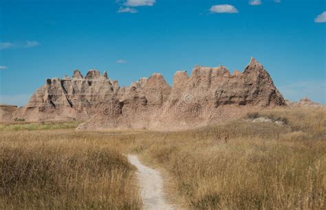 Layered Rock Formations Steep Canyons And Towering Spires Of Badlands