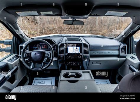 The black interior of a 2019 Ford F-250 pickup truck with a modern ...