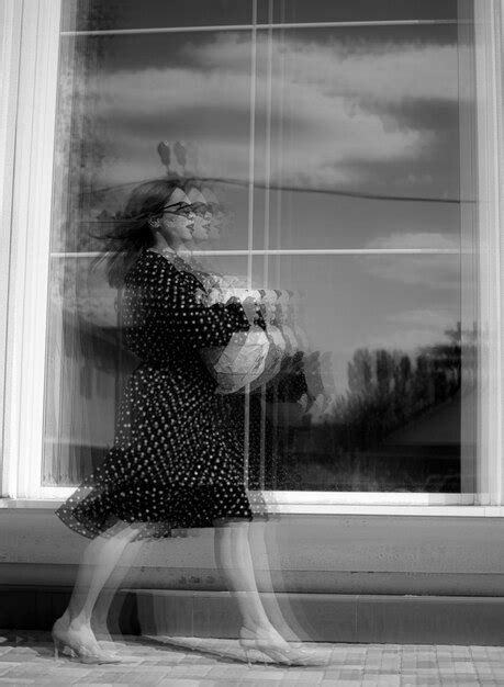 Premium Photo Rear View Of Woman Looking Through Window