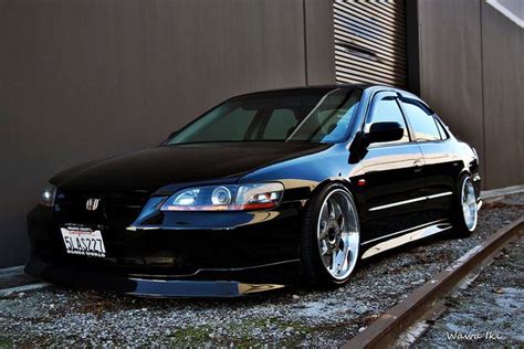 a black car parked in front of a building