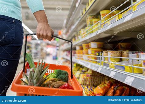 Woman With Food Basket At Grocery Or Supermarket Stock Photo Image Of