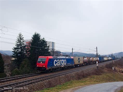 The Sbb Cargo Traxx Is Hauling A Container Freight Train By