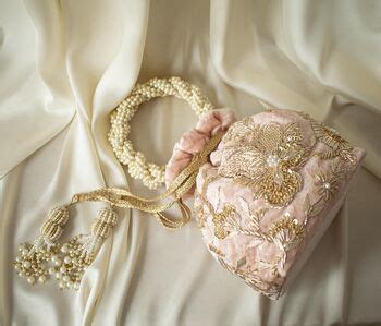 Arisha Nude Pink Velvet Potli Bag By Atiya Choudhury