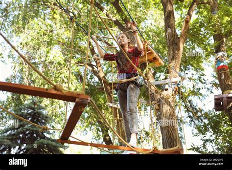 Teenage Girl Climbing In Adventure Park Summer Camp Stock Photo Alamy