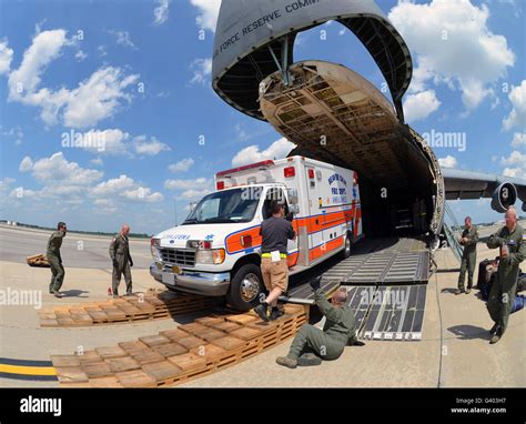 Airmen Load An Ambulance And Two Fire Trucks Onto A C 5 Galaxy Stock