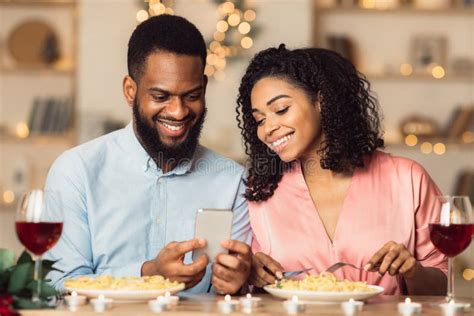 Smiling Black Couple Using Smartphone During Romantic Dinner Stock Image Image Of Technology