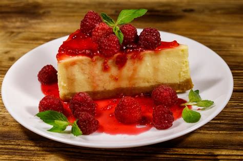 Premium Photo Piece Of Tasty New York Cheesecake With Raspberries And