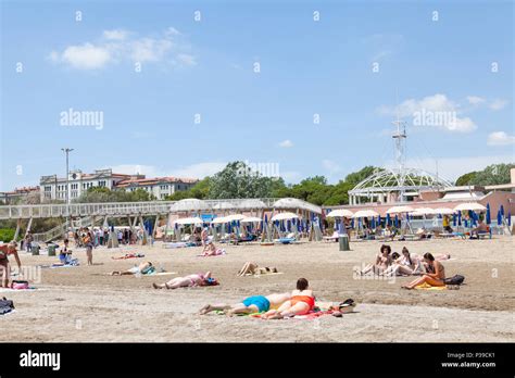 People sunbathing on Blue Moon Beach, Lido di Venezia, Lido Island ...