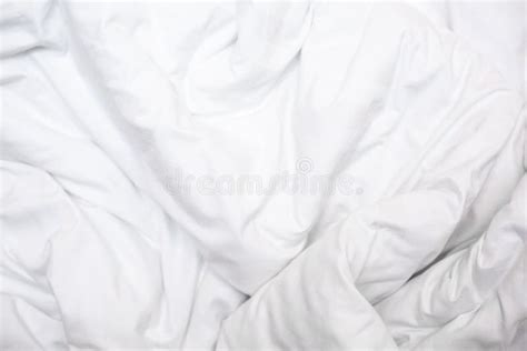 Top View Of A Messy Bedding Sheet After Night Sleep White Fabric Crease