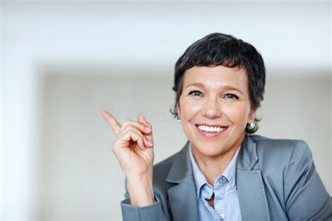 Female Executive Pointing At Something Portrait Of Mature Business