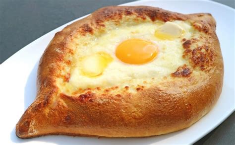 Premium Photo Freshly Baked Adjarian Khachapuri Cheese And Egg Filled