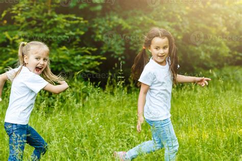 Happy children running around outside playing catch-up concept 20888841 ...