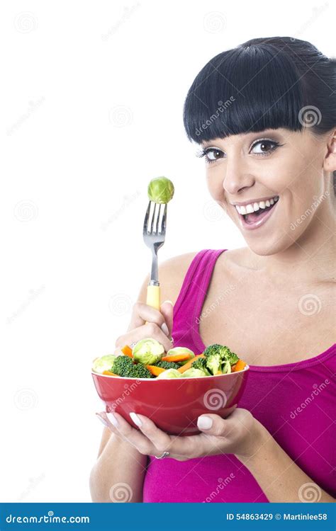 Attractive Healthy Young Woman Holding A Bowl Of Fresh Raw Vegetables