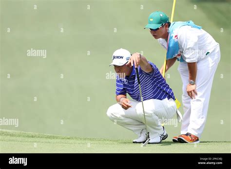 Japans Hideki Matsuyama And His Caddie Shota Hayafuji On The 7th Hole