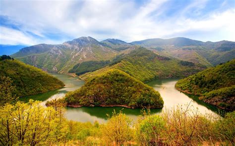 Summer Mountain Landscape With Green Forest River Blue Sky With Clouds