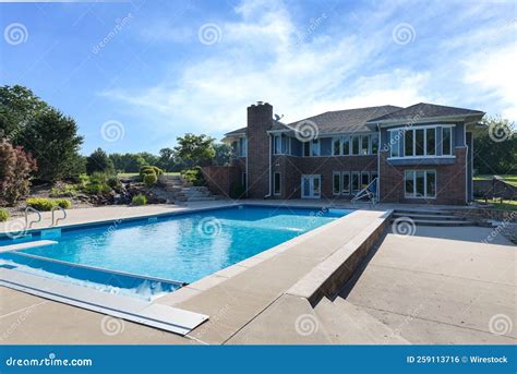 Exterior of a Luxurious House with a Big Pool and Green Garden ...