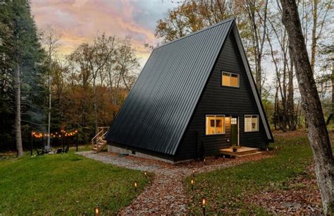 Premium Photo | A black house with a black roof and a house with a sky background