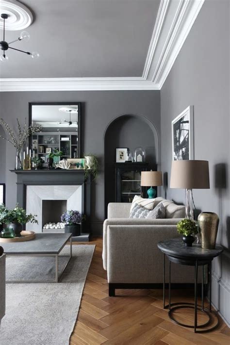 A Living Room Filled With Furniture And A Fire Place