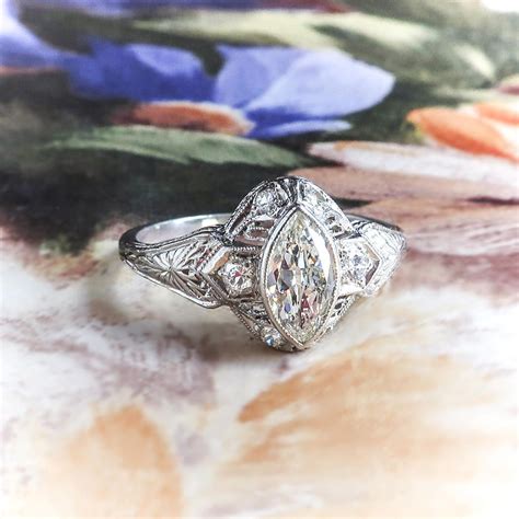 Antique Engagement Ring With A Marquis Diamond And A Filigree Setting