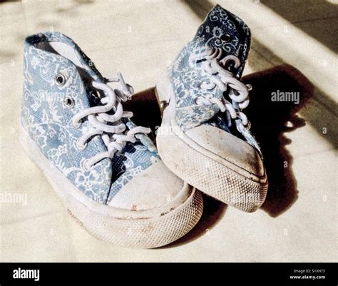 Scuffed toddler shoes Stock Photo - Alamy