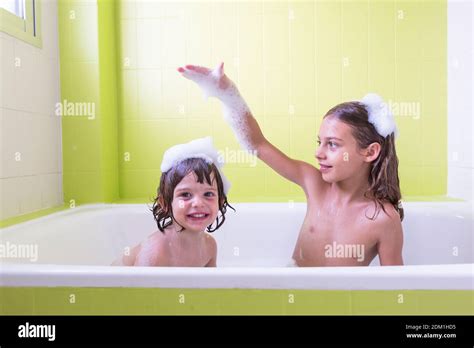 Siblings In The Tub Smiling High Resolution Stock Photography And