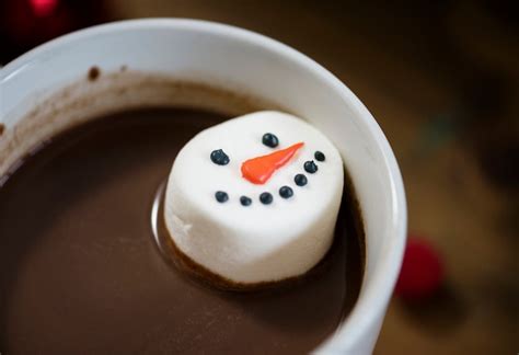 Premium Photo Snowman Marshmallow Dipped In Hot Chocolate