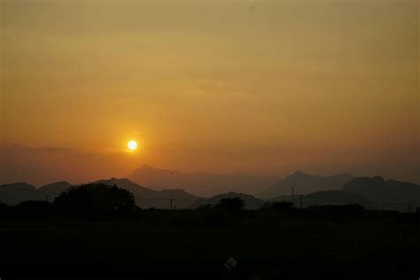 Scenic Sunset above Mountains on Horizon · Free Stock Photo