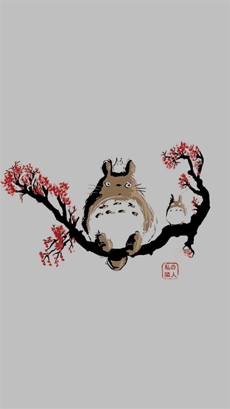 Download a totoro sitting on a branch with red flowers Wallpaper ...