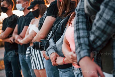 Photographer With Camera Group Of Protesting Young People That