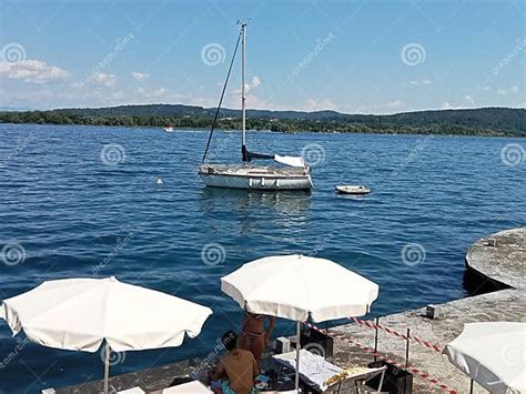 Town in Italy on Lake Maggiore Arona with Sailboats Editorial Stock ...